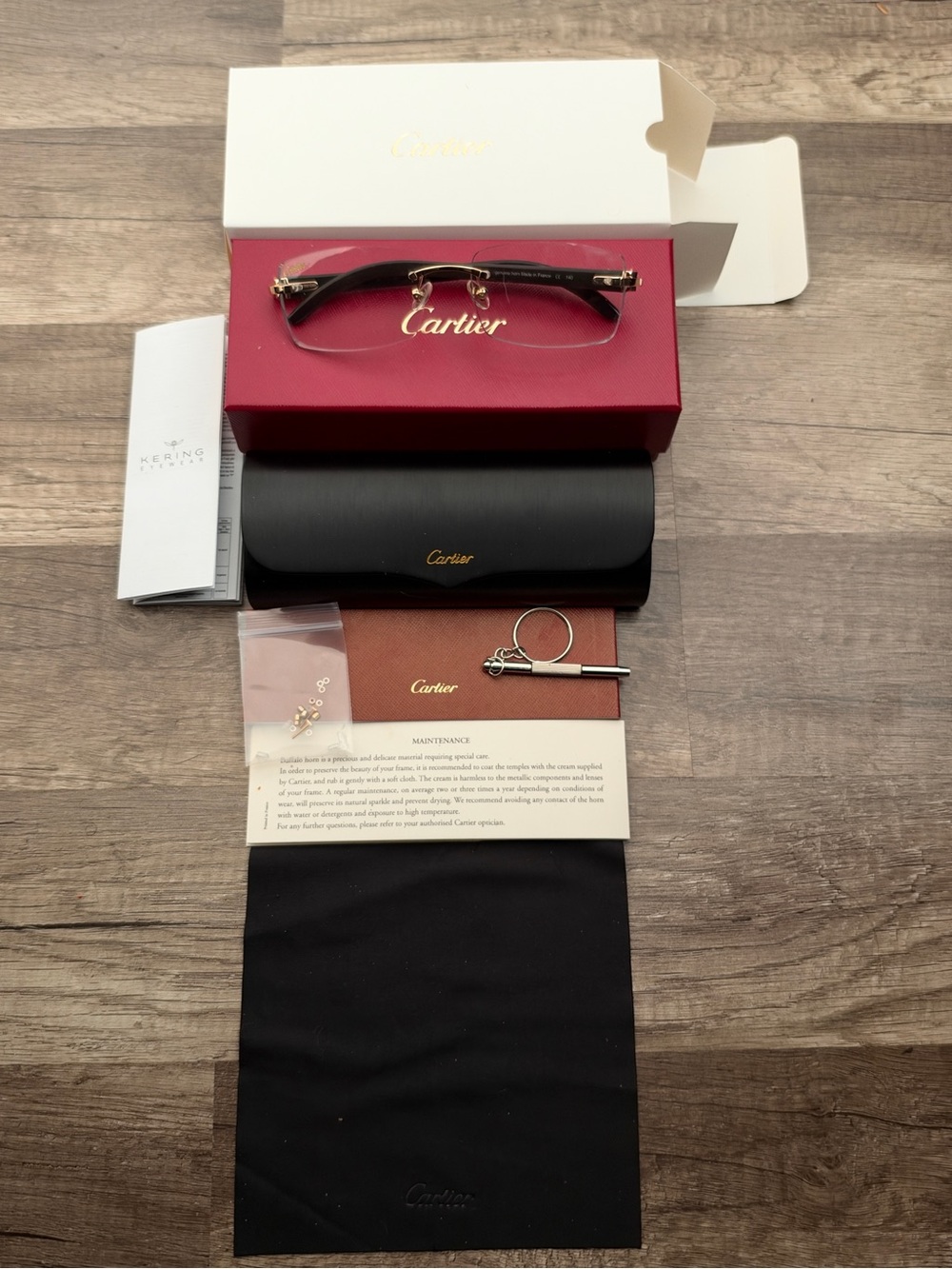 Cartier rimless buffalo horn glasses with clear signature lenses